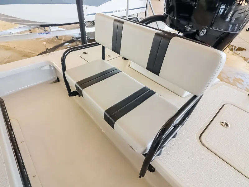 Slide: The Image of The 2026 Majek M2 Illusion features a cushioned bench seat with a black frame and white cushions. - 18