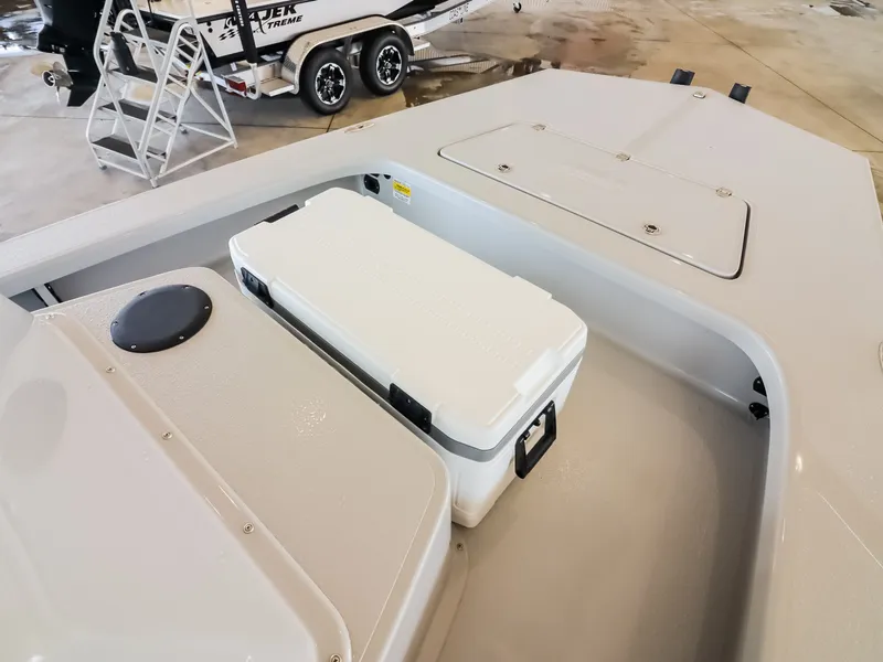Slide: The Image of The image shows the deck of a 2026 Majek M2 Illusion boat with a white cooler. - 9