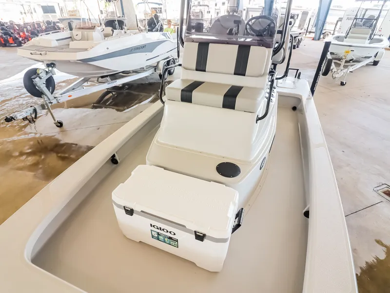 Slide: The Image of The image shows a 2026 Majek M2 Illusion boat with a white Igloo cooler on board. - 10