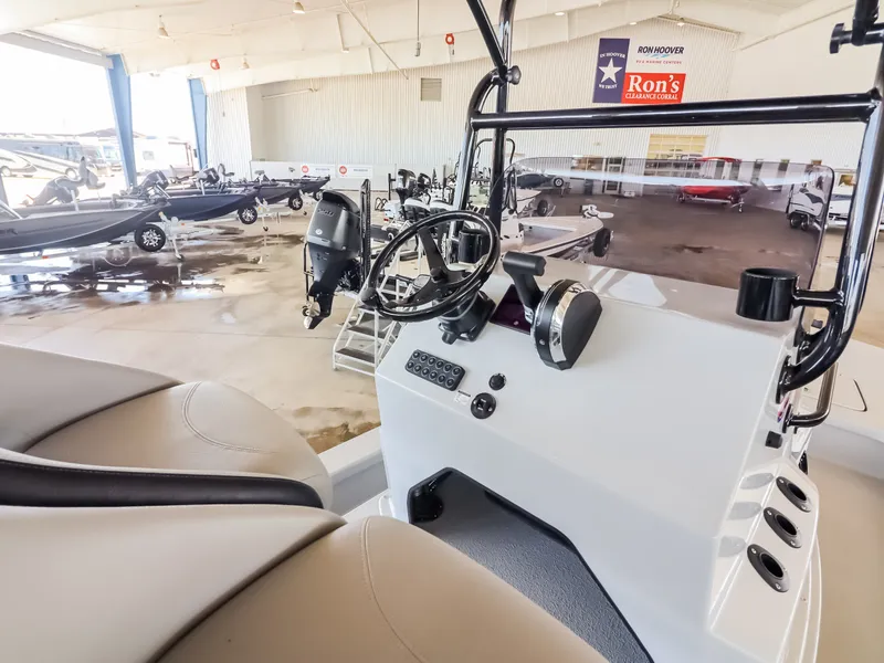 Slide: The Image of The image shows the cockpit of a 2026 Majek M2 Illusion boat in a showroom. - 15
