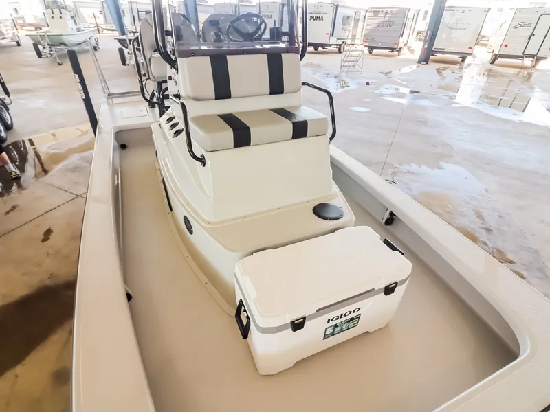 Slide: The Image of The image shows a 2026 Majek M2 Illusion boat with a central console and a cooler. - 11