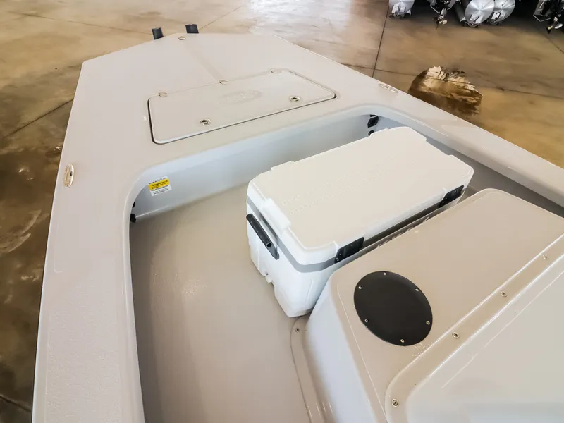 Slide: The Image of The image shows the deck of a Majek M2 Illusion boat with a cooler. - 8