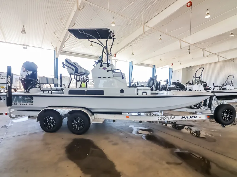 Slide: The Image of The image shows a 2026 Majek M2 Illusion boat in a showroom. - 7