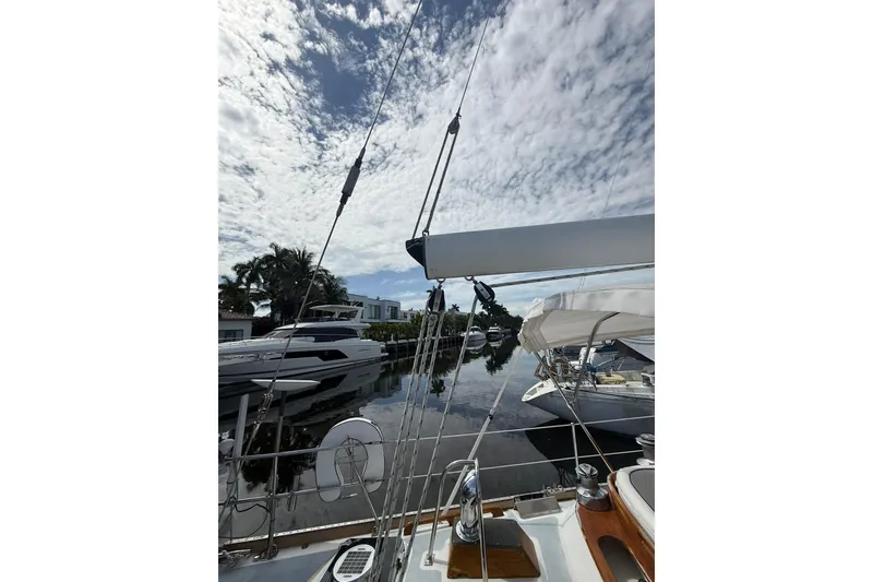 Slide: The Image of Sailboat Little Harbor LH46, 1986 model, docked with clear sky and calm water. - 27