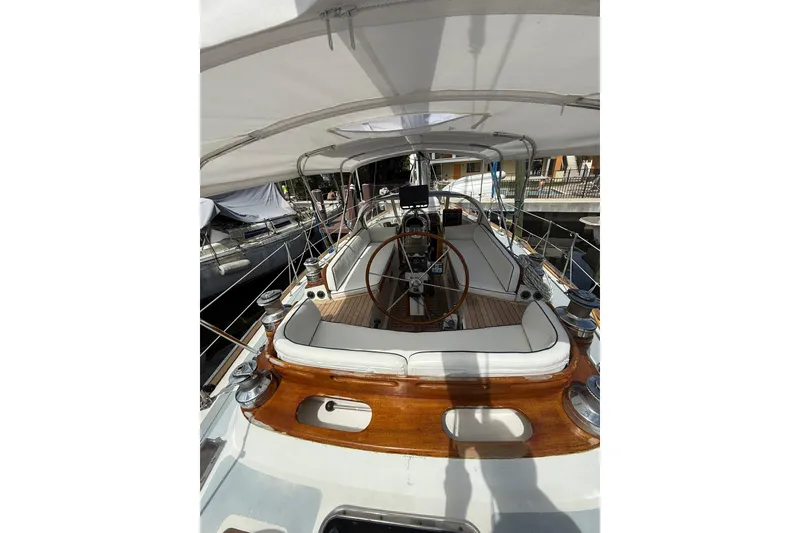 Slide: The Image of 1986 Little Harbor LH46 yacht cockpit with wooden accents and steering wheel. - 32