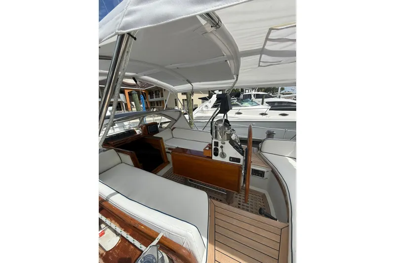 Slide: The Image of 1986 Little Harbor LH46 yacht cockpit with white seating and wooden accents. - 36