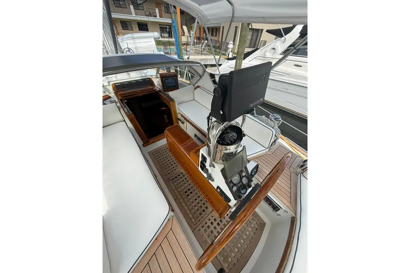 Slide: The Image of Cockpit of 1986 Little Harbor LH46 yacht with wooden accents and navigation equipment. - 38