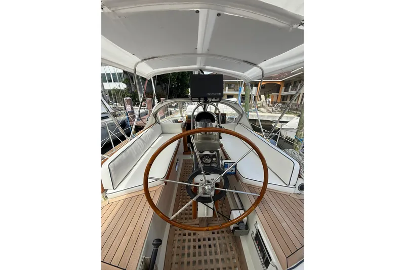 Slide: The Image of Cockpit of 1986 Little Harbor LH46 sailboat with wooden steering wheel and navigation equipment. - 39