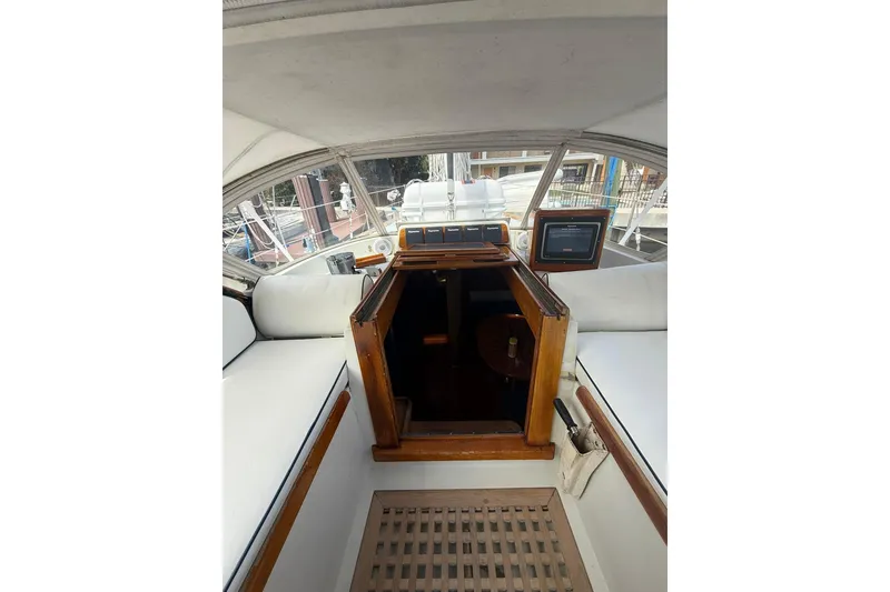 Slide: The Image of 1986 Little Harbor LH46 yacht cockpit with wooden hatch and white seating. - 40