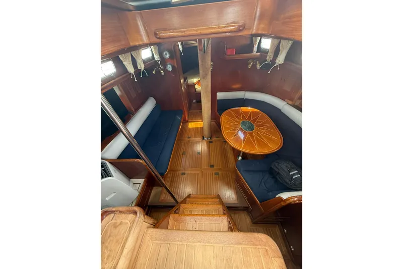 Slide: The Image of Interior of 1986 Little Harbor LH46 yacht with wooden flooring and elegant seating area. - 42