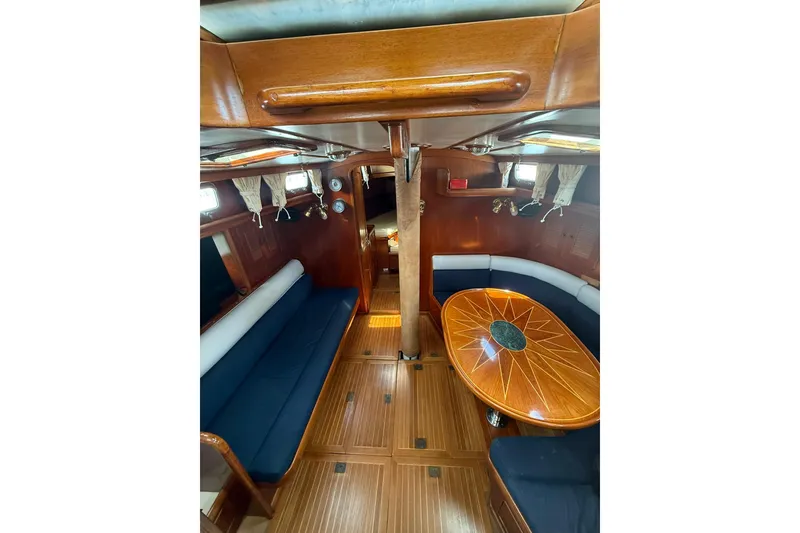 Slide: The Image of Interior of 1986 Little Harbor LH46 yacht with wooden finishes and elegant seating area. - 43