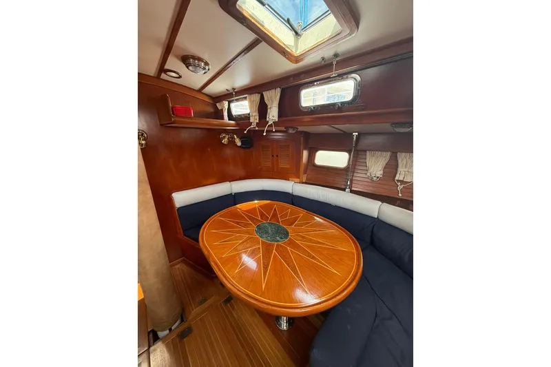 Slide: The Image of Interior of 1986 Little Harbor LH46 yacht with elegant wood table and cozy seating. - 44