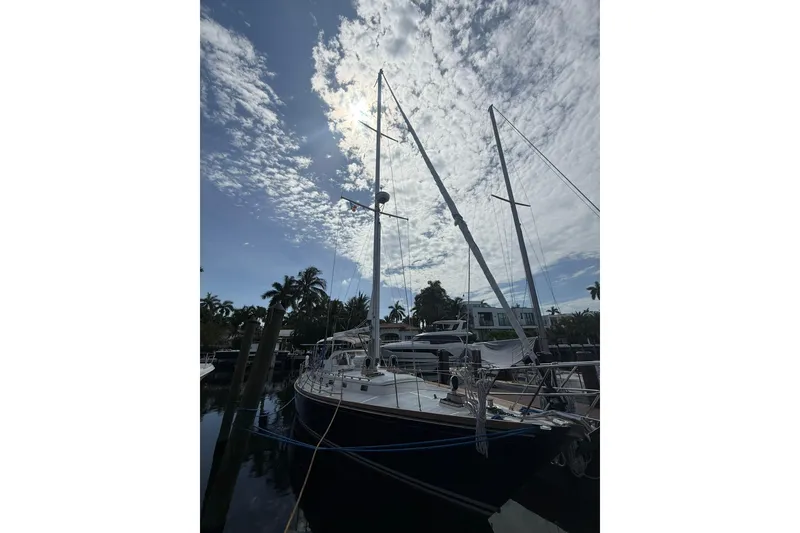 Slide: The Image of Sailboat Little Harbor LH46, 1986 model, docked under a partly cloudy sky. - 5
