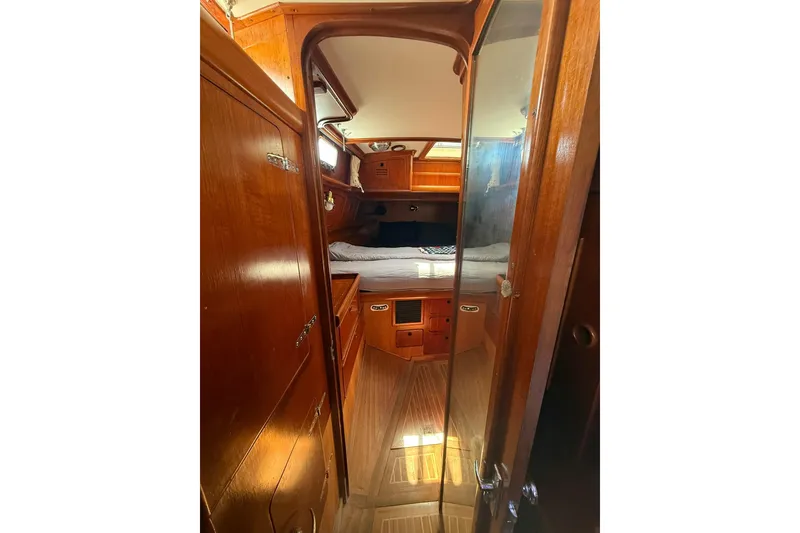 Slide: The Image of Interior of 1986 Little Harbor LH46 yacht with wooden cabinetry and cozy sleeping area. - 52