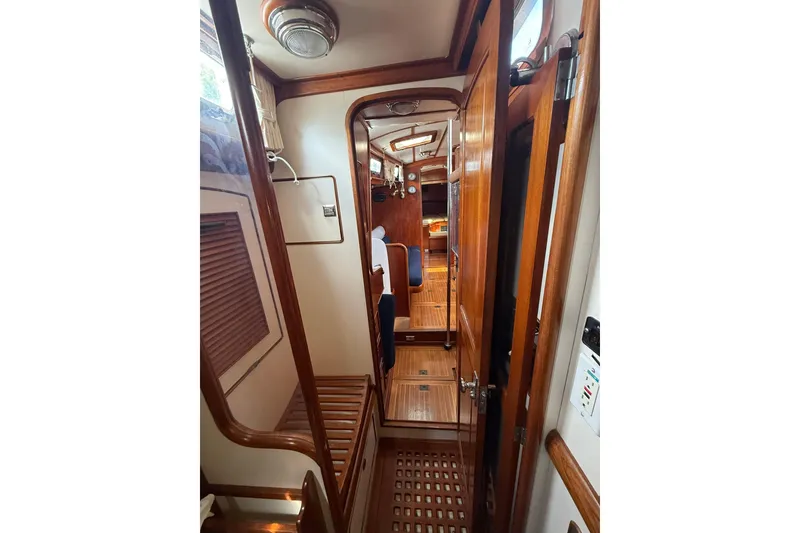 Slide: The Image of Interior of 1986 Little Harbor LH46 yacht, featuring wooden finishes and cozy cabin layout. - 59