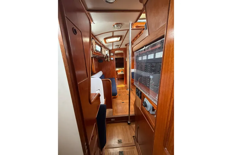 Slide: The Image of Interior of 1986 Little Harbor LH46 yacht with wooden paneling and seating area. - 60