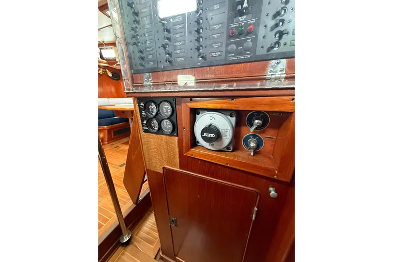 Slide: The Image of Control panel of 1986 Little Harbor LH46 yacht with gauges and switches. - 62