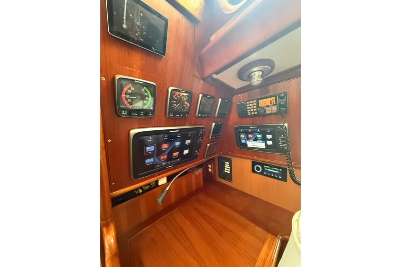 Slide: The Image of Control panel of 1986 Little Harbor LH46 yacht with navigation instruments and communication devices. - 64