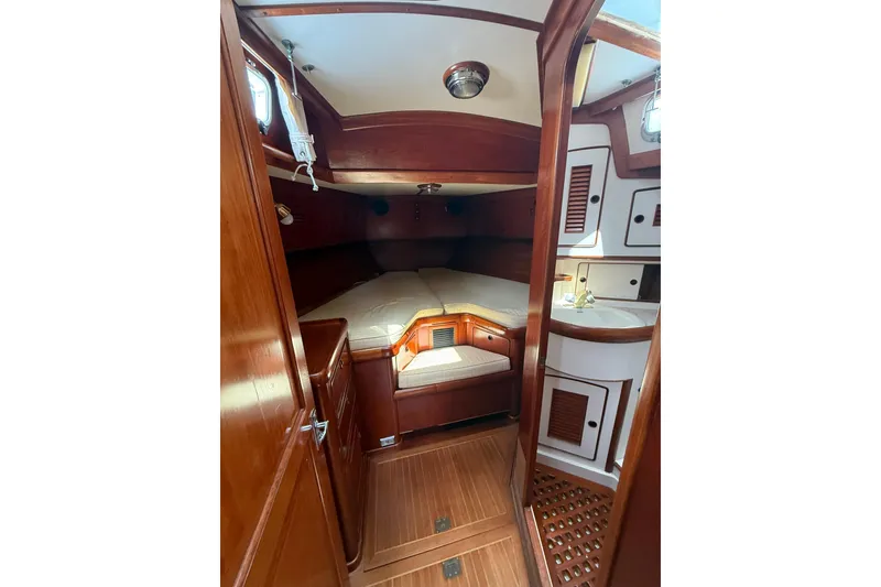 Slide: The Image of Cozy cabin interior of 1986 Little Harbor LH46 yacht with wooden finishes and built-in storage. - 67