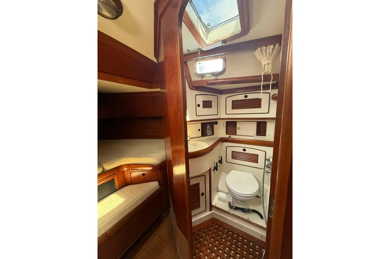 Slide: The Image of Interior of 1986 Little Harbor LH46 yacht featuring a cozy cabin and compact bathroom. - 68