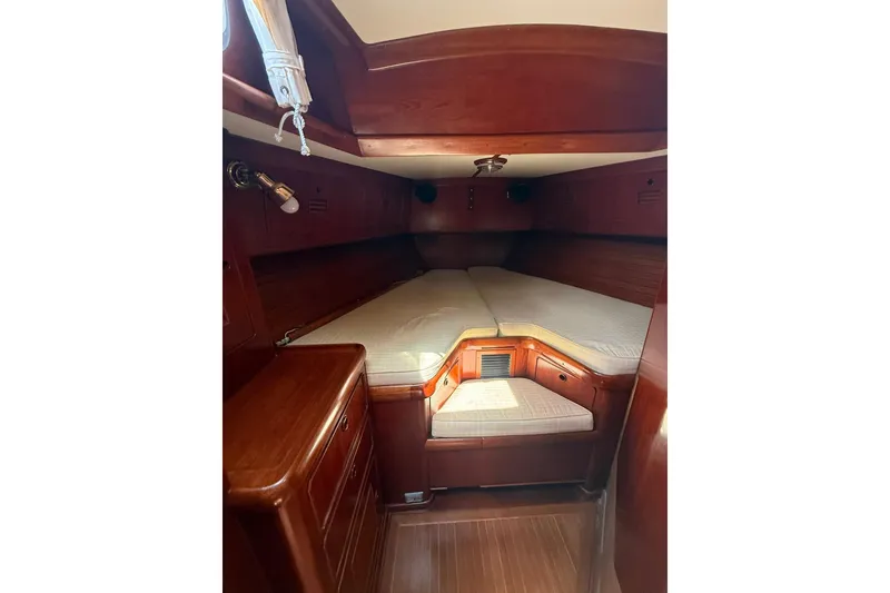 Slide: The Image of Interior cabin of 1986 Little Harbor LH46 yacht with wooden finish and cozy bedding. - 69