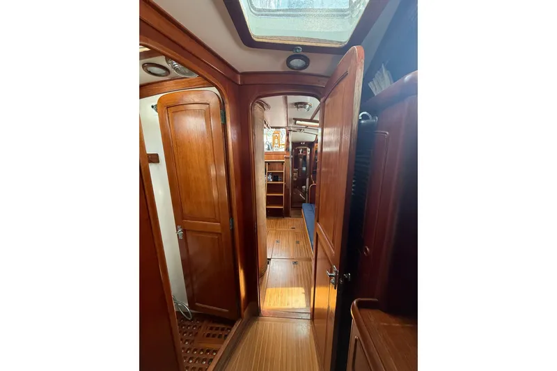 Slide: The Image of Interior view of 1986 Little Harbor LH46 yacht with wooden doors and flooring. - 70
