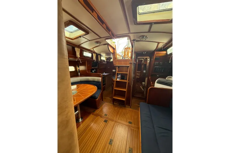 Slide: The Image of Interior of 1986 Little Harbor LH46 yacht with wooden finishes and cozy seating area. - 72
