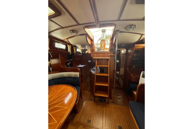Slide: The Image of Interior of 1986 Little Harbor LH46 yacht, featuring elegant woodwork and cozy seating area. - 73