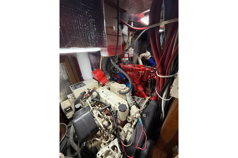 Slide: The Image of Engine room of 1986 Little Harbor LH46 yacht with visible machinery and wiring. - 74