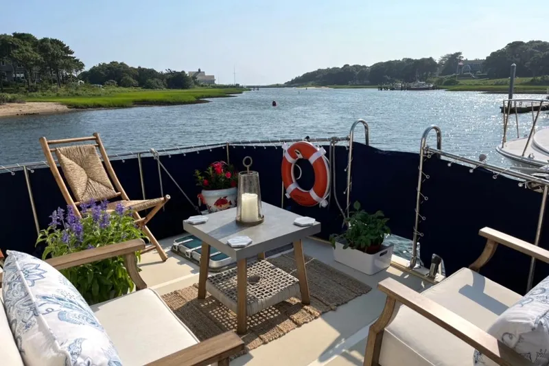 Slide: The Image of Cozy deck of 1987 Albin 37 Palm Beach yacht with scenic river view. - 1