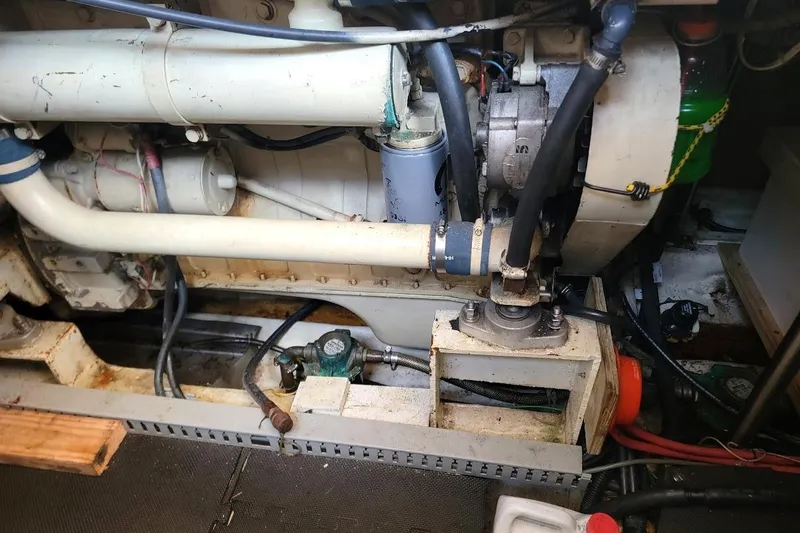 Slide: The Image of Engine compartment of a 1987 Albin 37 Palm Beach boat, showcasing mechanical components. - 18