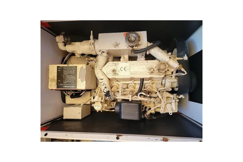 Slide: The Image of Engine of a 1987 Albin 37 Palm Beach boat, showcasing mechanical components. - 19