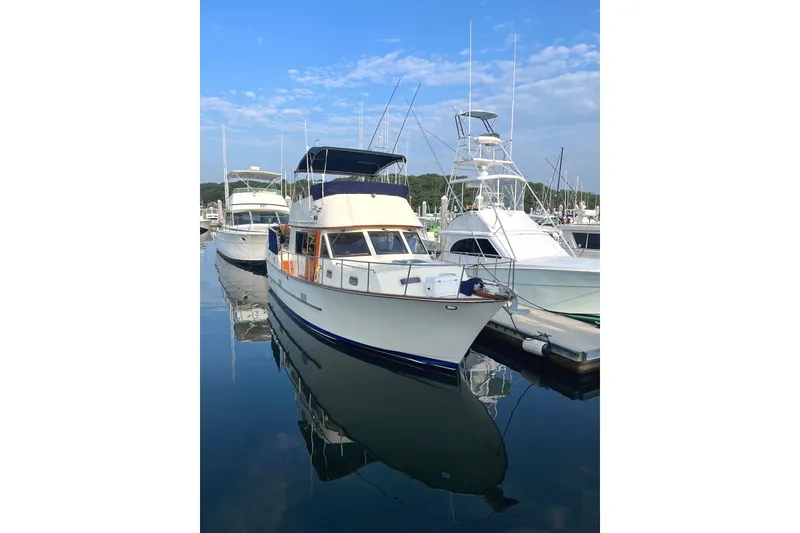 Slide: The Image of 1987 Albin 37 Palm Beach yacht docked at marina under clear blue sky. - 20
