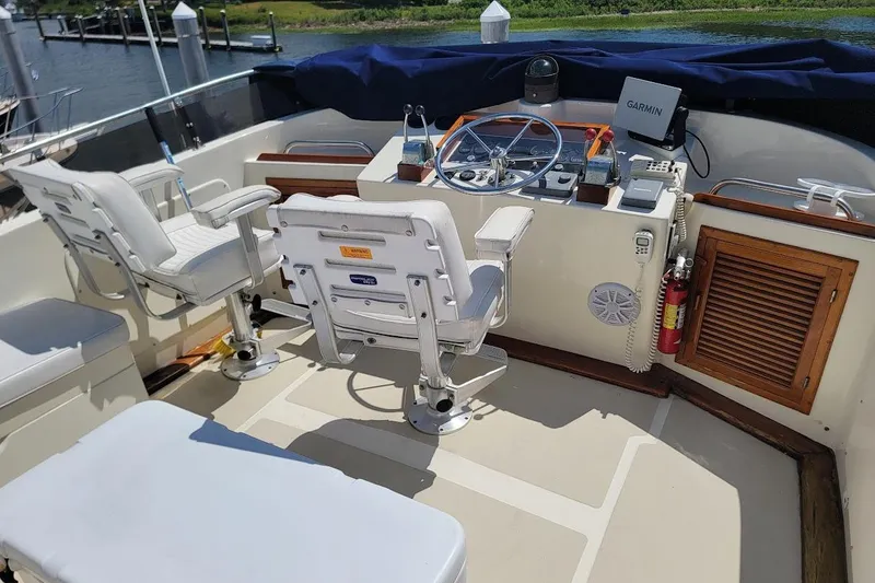 Slide: The Image of Cockpit of 1987 Albin 37 Palm Beach yacht with steering wheel and navigation equipment. - 21