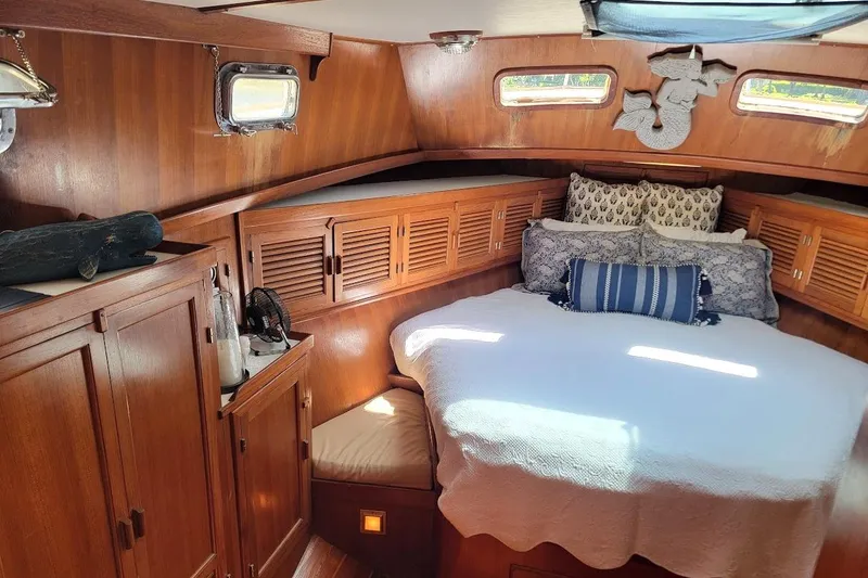Slide: The Image of Cozy cabin interior of 1987 Albin 37 Palm Beach with wooden furnishings and comfortable bedding. - 26