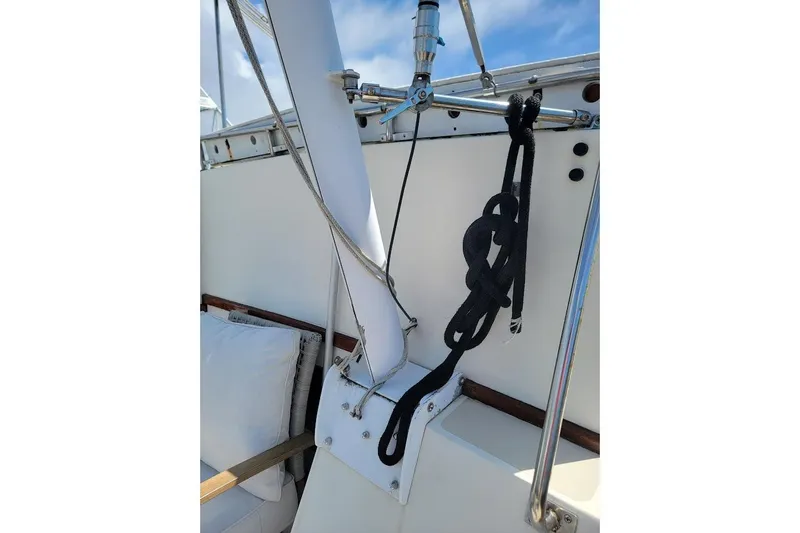 Slide: The Image of 1987 Albin 37 Palm Beach yacht deck with rigging and ropes under a clear sky. - 32