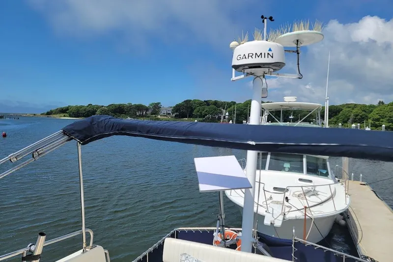 Slide: The Image of 1987 Albin 37 Palm Beach yacht docked with Garmin radar, scenic waterfront view. - 34