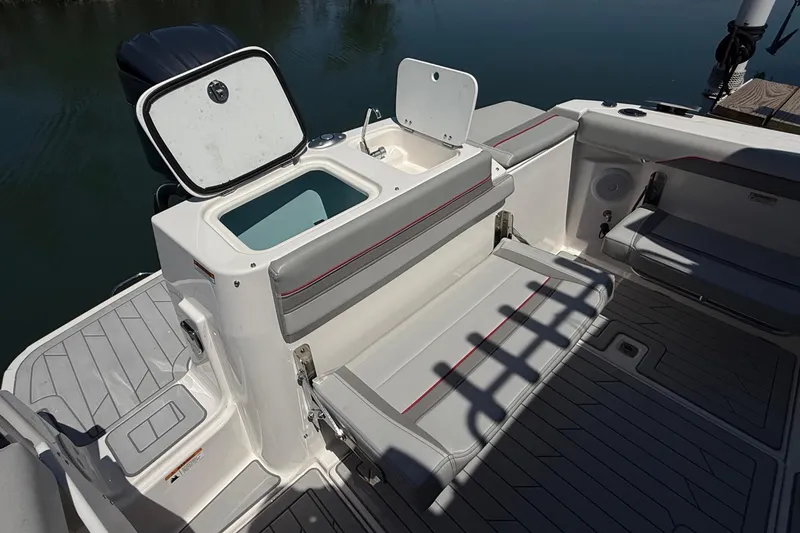 Slide: The Image of 2024 Solara S-250 CW boat interior with open storage compartment and seating. - 10