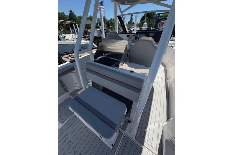 Slide: The Image of 2024 Solara S-250 CW boat interior with sleek seating and modern helm design. - 12