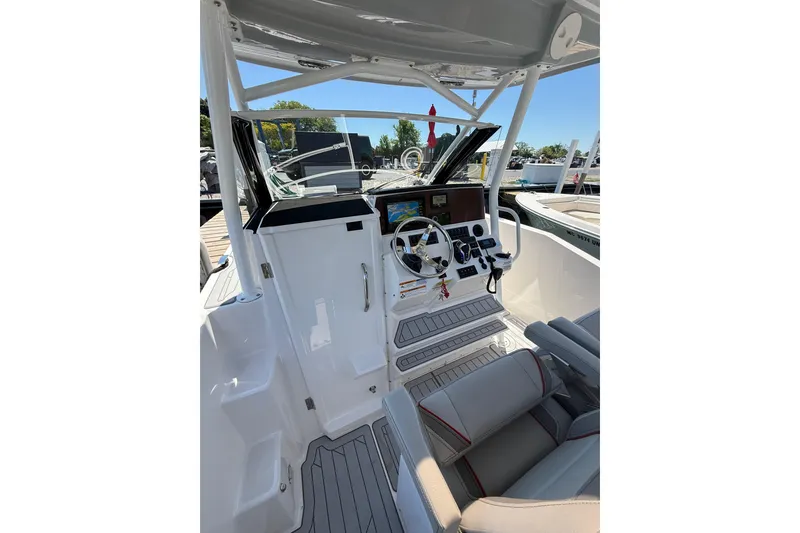 Slide: The Image of 2024 Solara S-250 CW boat cockpit with modern controls and comfortable seating. - 16