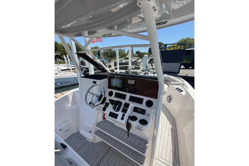 Slide: The Image of 2024 Solara S-250 CW boat cockpit with modern controls and steering wheel. - 17