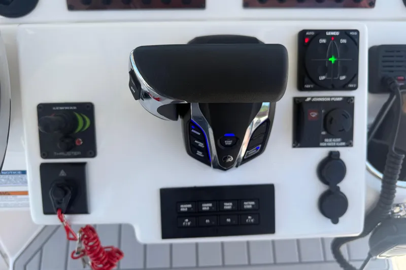 Slide: The Image of Control panel of 2024 Solara S-250 CW boat featuring throttle and navigation controls. - 19