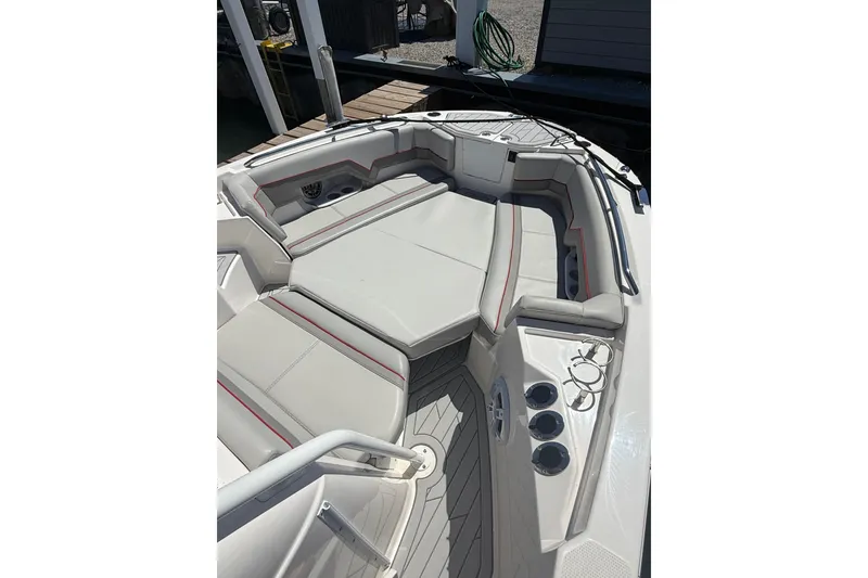 Slide: The Image of 2024 Solara S-250 CW boat interior with cushioned seating and cup holders. - 23