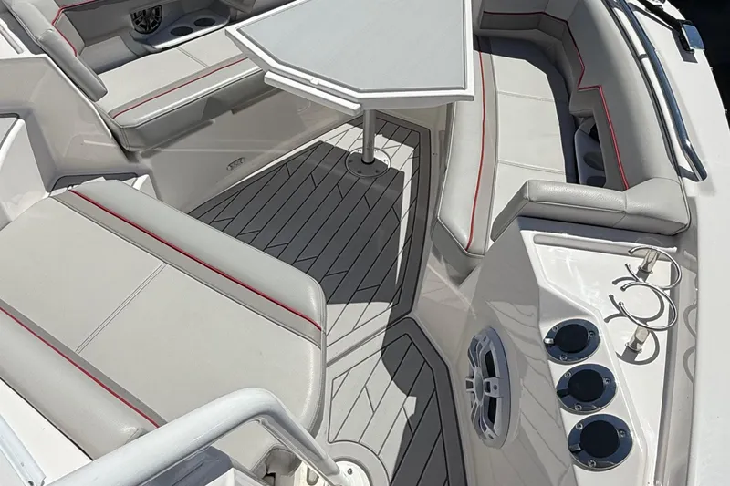 Slide: The Image of 2024 Solara S-250 CW boat interior with cushioned seating and table. - 24