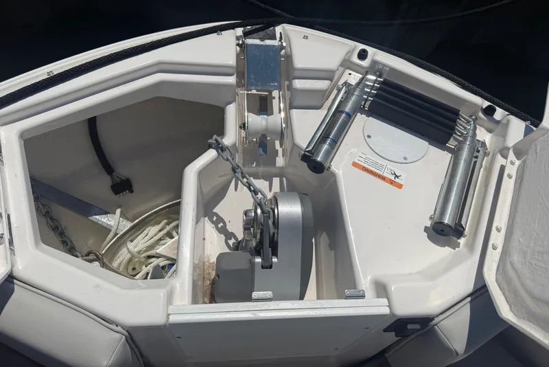 Slide: The Image of Anchor compartment of 2024 Solara S-250 CW boat, featuring chain and rope storage. - 25