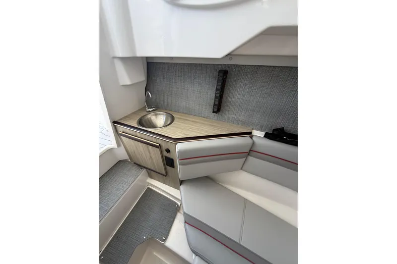 Slide: The Image of 2024 Solara S-250 CW interior with compact kitchenette and seating area. - 28