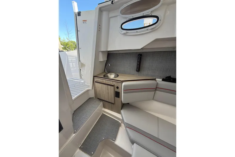 Slide: The Image of 2024 Solara S-250 CW cabin interior with seating, sink, and steps. - 29