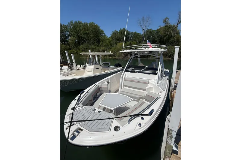 Slide: The Image of 2024 Solara S-250 CW boat docked, featuring sleek design and spacious seating. - 3