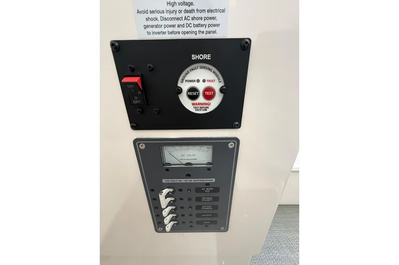 Slide: The Image of Electrical panel of 2024 Solara S-250 CW with voltage meter and safety switches. - 34