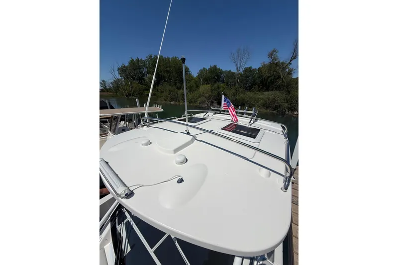 Slide: The Image of 2024 Solara S-250 CW boat docked, featuring sleek design and American flag. - 35